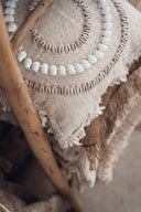 Housse de coussin Gili en coton et coquillages