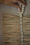 Decorative sheet in raffia and shells