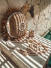Round cushion cover in raffia and shells