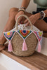 Small colorful wicker bag with fringe