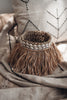 Bohemian basket with raffia fringes and shells