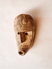 Masque ethnique en bois sculpté