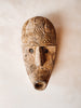 Masque ethnique en bois sculpté